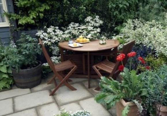 Patio with containers and table and chairs